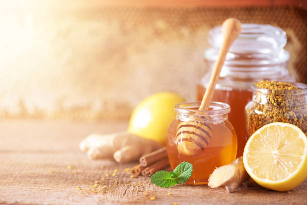Organic honey with other ingredients for hot tea like lemon, ginger, and mint  