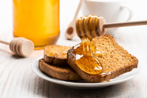 Raw honey on wheat toast